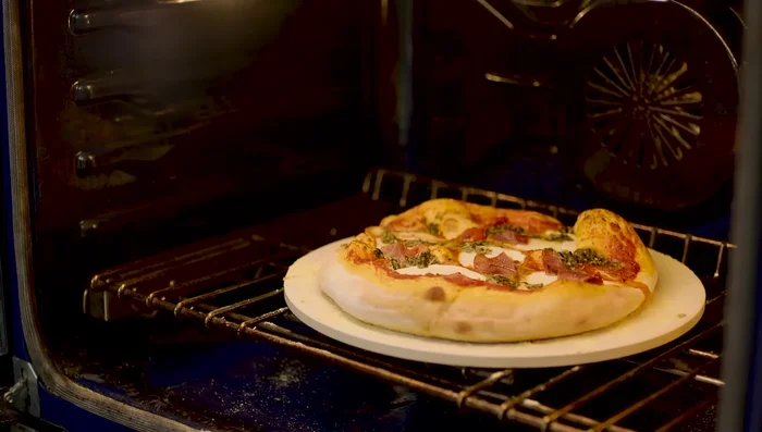 Remove the pizza from the stone.