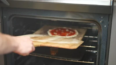 Compare the results: the steel-baked pizza is significantly better cooked than the stone-baked pizza.
