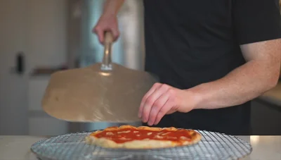 Compare the results: the steel-baked pizza is significantly better cooked than the stone-baked pizza.