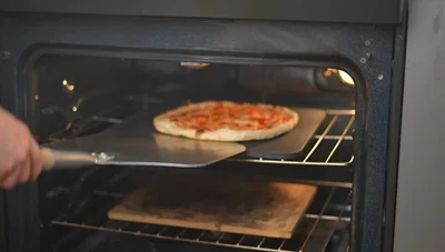 Compare the results again: Both pizzas look good, but the steel-baked pizza shows slightly better charring and crispness.