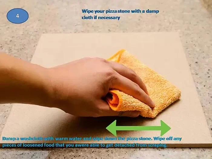 Wipe the stone with a damp cloth. Dampen a washcloth with warm water and wipe down the stone to remove any loosened food particles.