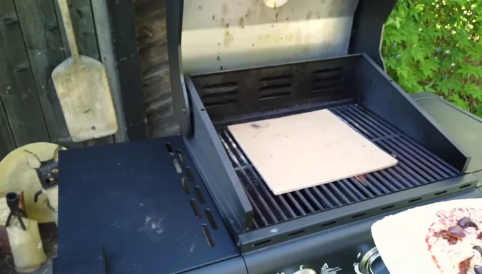 Place the pizza (on baking paper for easier handling) on the preheated stone. Turn frequently to cook evenly.
