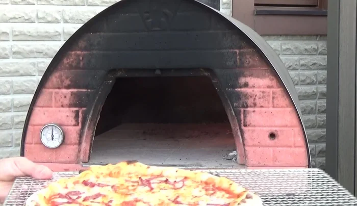 Remove the pizza from the oven once cooked.