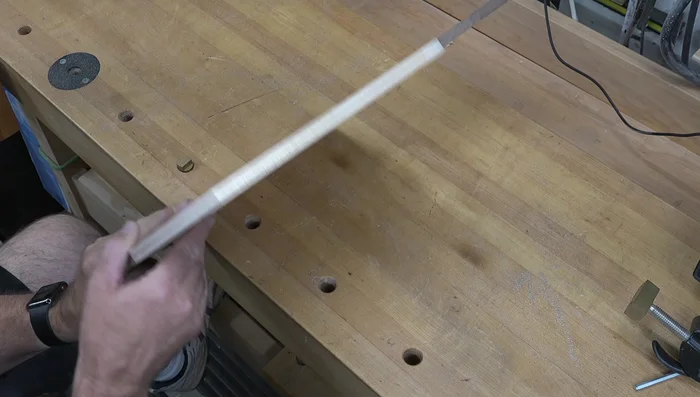 Taper the edges: Draw lines 1 inch and 7/32 inch from the edges to guide the planing process. Use a larger smoothing plane to remove most of the material and a block plane for detailed shaping and creating the tapers along the edges.