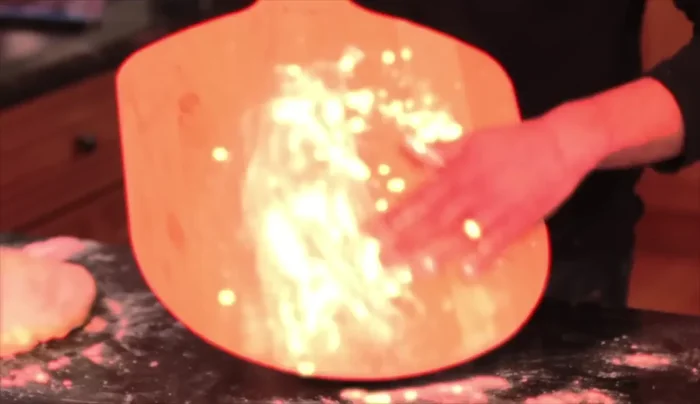 Use a gentle jerking motion to help the dough slide onto the peel.