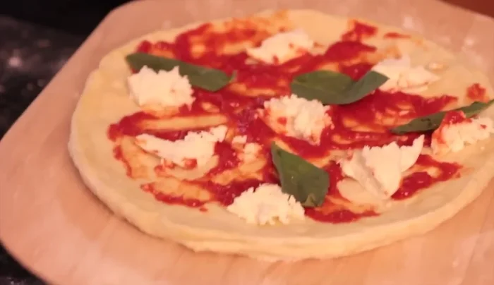 Use a gentle jerking motion to help the dough slide onto the peel.