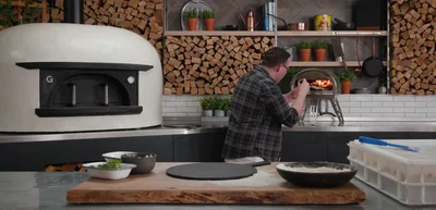 If the base cooks faster than the toppings, move the pizza to the mouth of the oven to finish cooking the toppings without burning the base.