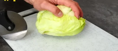 Slice coriander, olives, and feta cheese for a salad.