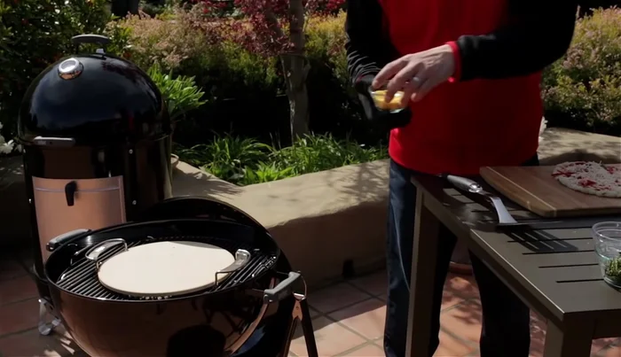 Sprinkle a little cornmeal on the preheated pizza stone.