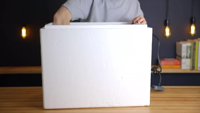 Optionally, place the cooling rack inside the cooler to prevent direct contact between the dough and the heating mat.