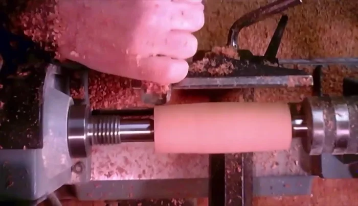 Prepare the handles. Turn the cherry wood blanks into handle shapes on the lathe.