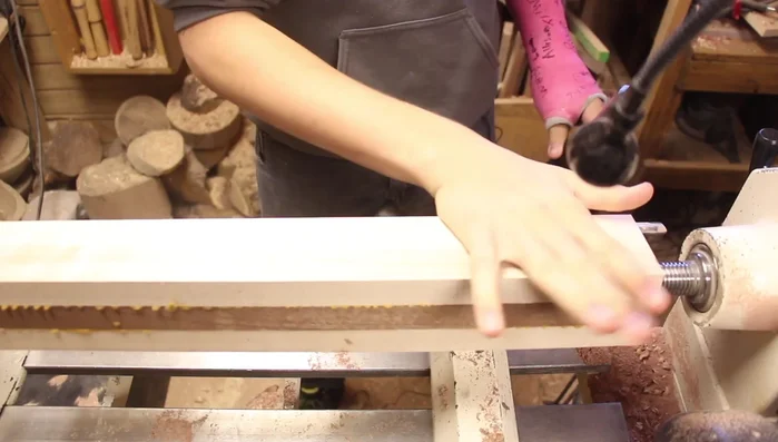 Use a spindle roughing gouge to remove the corners and shape the blank.