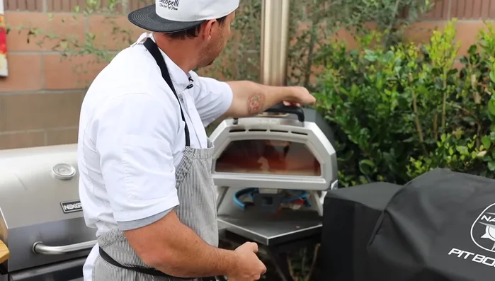 Preheat for 40-60 minutes (or up to 1 hour) to reach the optimal temperature for pizza cooking. The bottom of the oven (the stone) should reach around 700°F (371°C).
