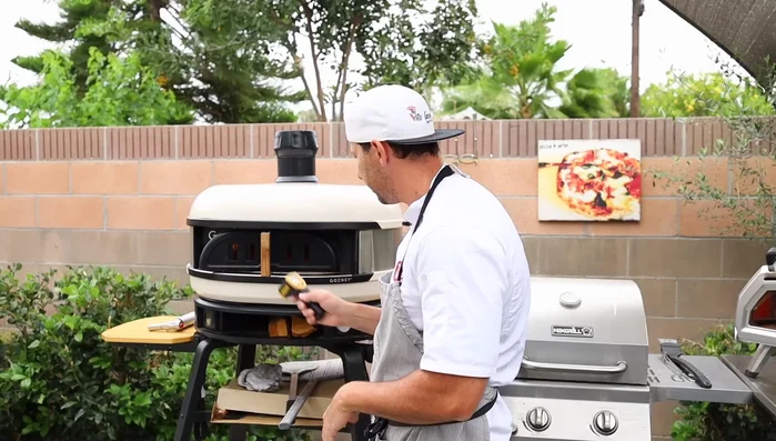 Check the temperature using a pizza oven thermometer or laser thermometer to ensure the stone is hot enough. Aim for 700°F (371°C) or slightly higher. The bottom is what truly matters!
