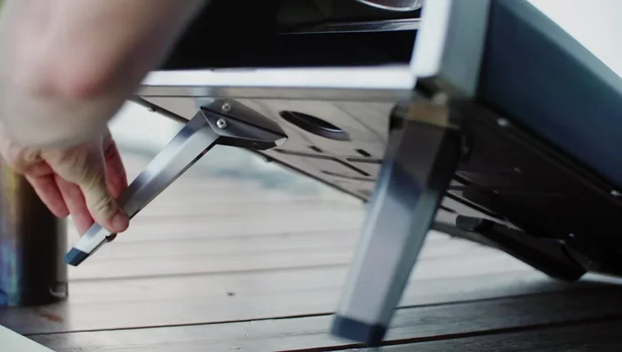 Insert the stone baking board and flame keeper.