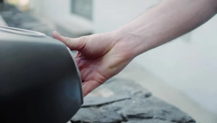 Remove the chimney cap and open the chimney vent for optimum airflow.