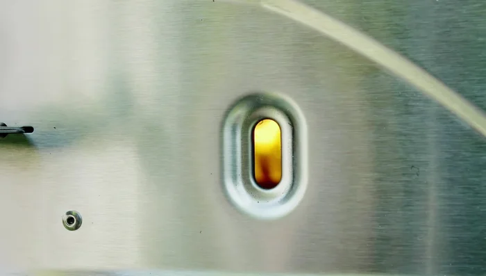 After five minutes or when the starter pellets are alight, gradually add more pellets to the hopper until full.