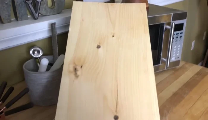 Acquire materials: Get a piece of pine (I used a pre-cut offcut), and garage hooks from a hardware store or dollar store.