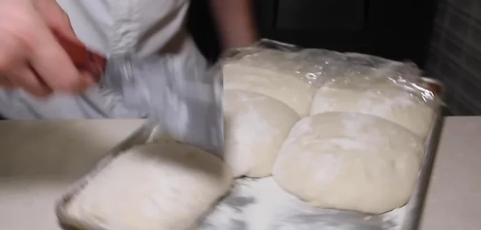 Prepare pizza dough (refer to the video for dough preparation).