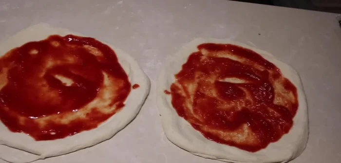 Pre-cook the pizza dough.