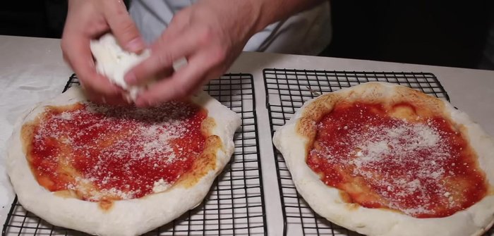 Add pizza sauce, cheese, and any desired toppings.