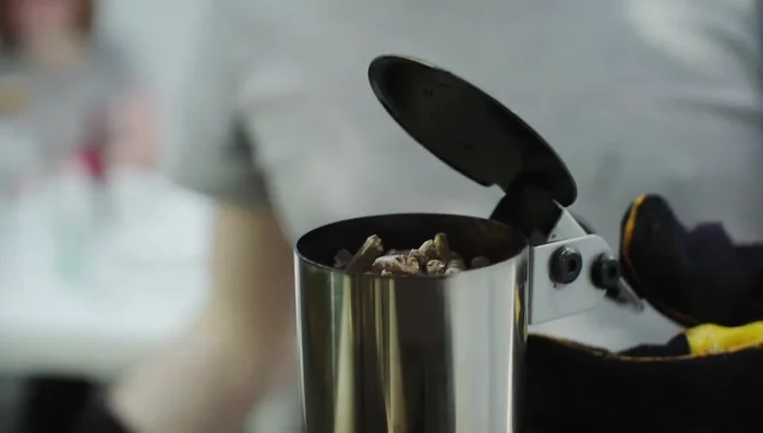 Continue to top up pellets little and often until the hopper is full. A full hopper will burn for 15 minutes.