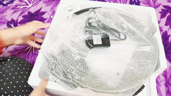 Inspect the pan's features: non-stick coating, depth, diameter, handle, and thermostat insertion point.