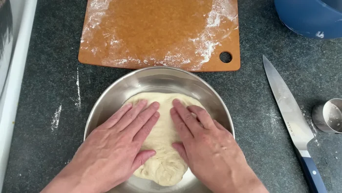 Assemble the Pizza: Add a layer of pizza sauce, then sprinkle toppings and shredded mozzarella cheese evenly.