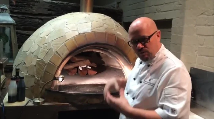 Move the embers to the back of the oven 30 minutes before cooking to allow the front to cool slightly.