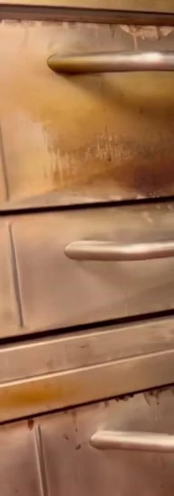 Give the oven a quick scrub to remove any remaining loose particles.