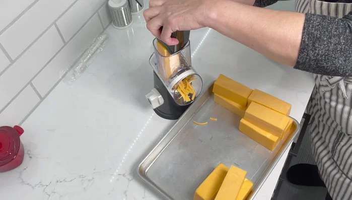 Repeat steps 3 and 4 until all the cheese is grated.