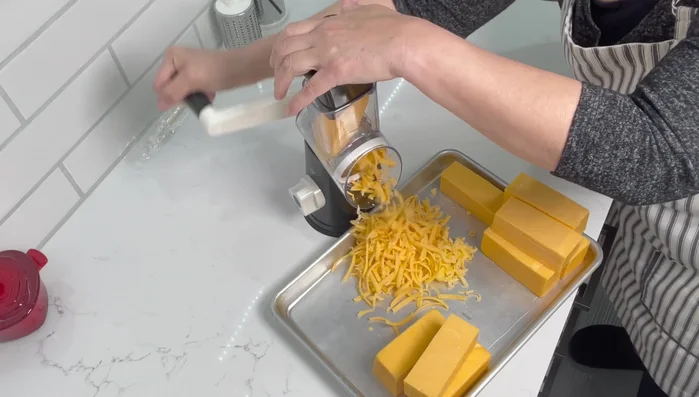 Repeat steps 3 and 4 until all the cheese is grated.