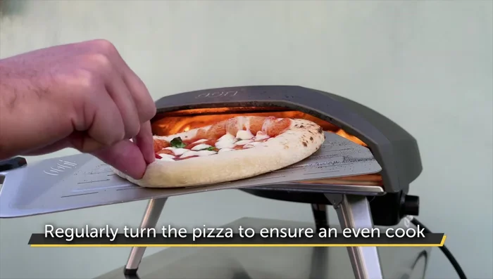 Cook the pizza: Cook for approximately 60 seconds total, adjusting the flame if necessary to prevent burning.