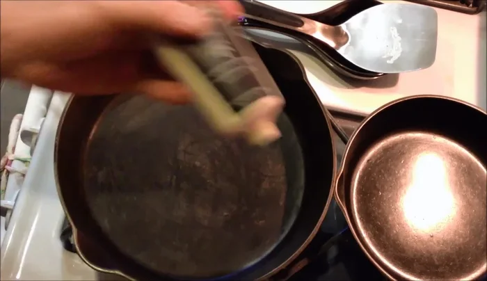 Wipe off any excess oil, ensuring an even coating.