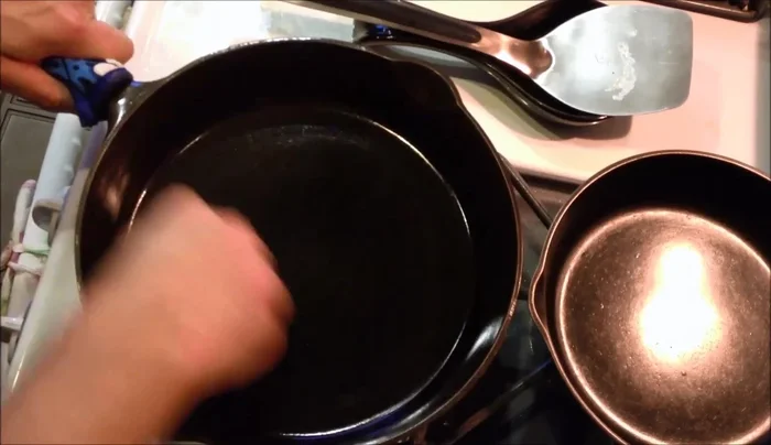 Wipe off any excess oil, ensuring an even coating.