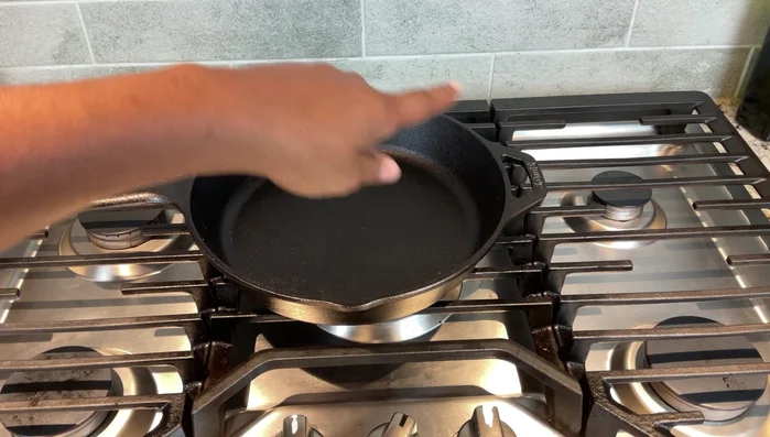 Pre-seasoned cast iron skillet on stove