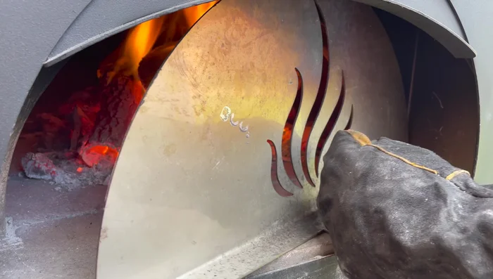 Add another log to maintain temperature if necessary before cooking.