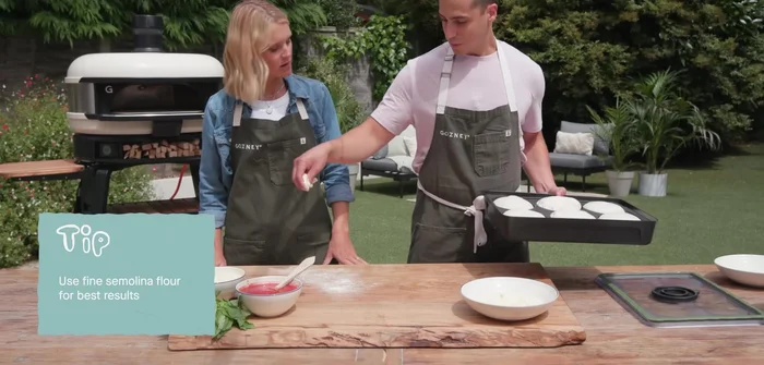 Add sauce, leaving a gap between the crust and sauce. Add cheese and basil.