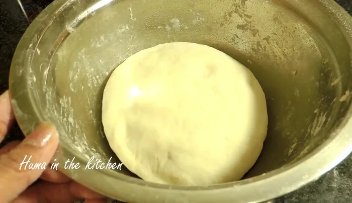 Let the dough rise: Place the dough in a greased bowl, cover, and let it rise for 1.5 hours.