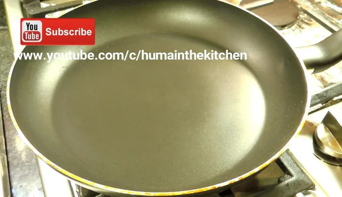 Cook the pizza base: Cook one side of the pizza base in the pan for 2-3 minutes until lightly browned.