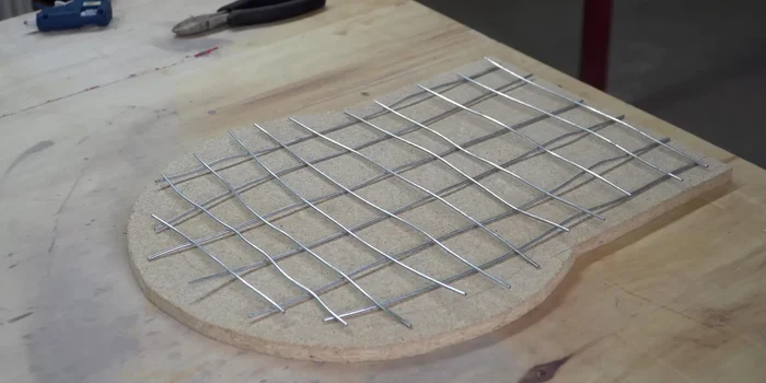 Pour the concrete slab, adding reinforcement bars, and vibrate the mold to release air bubbles.