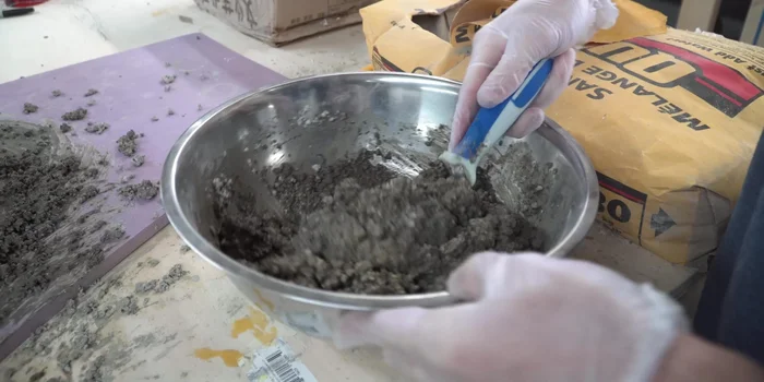 Cut and mortar thin concrete bricks onto the oven.