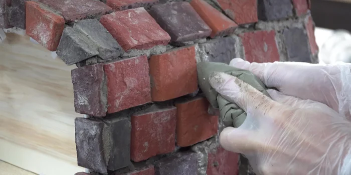 Remove the oven body from its mold and apply a layer of refractory cement to the interior.