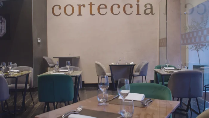 Restaurant interior, tables set for dining