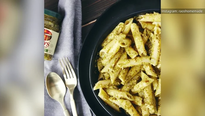 Penne pasta coated in classic pesto.