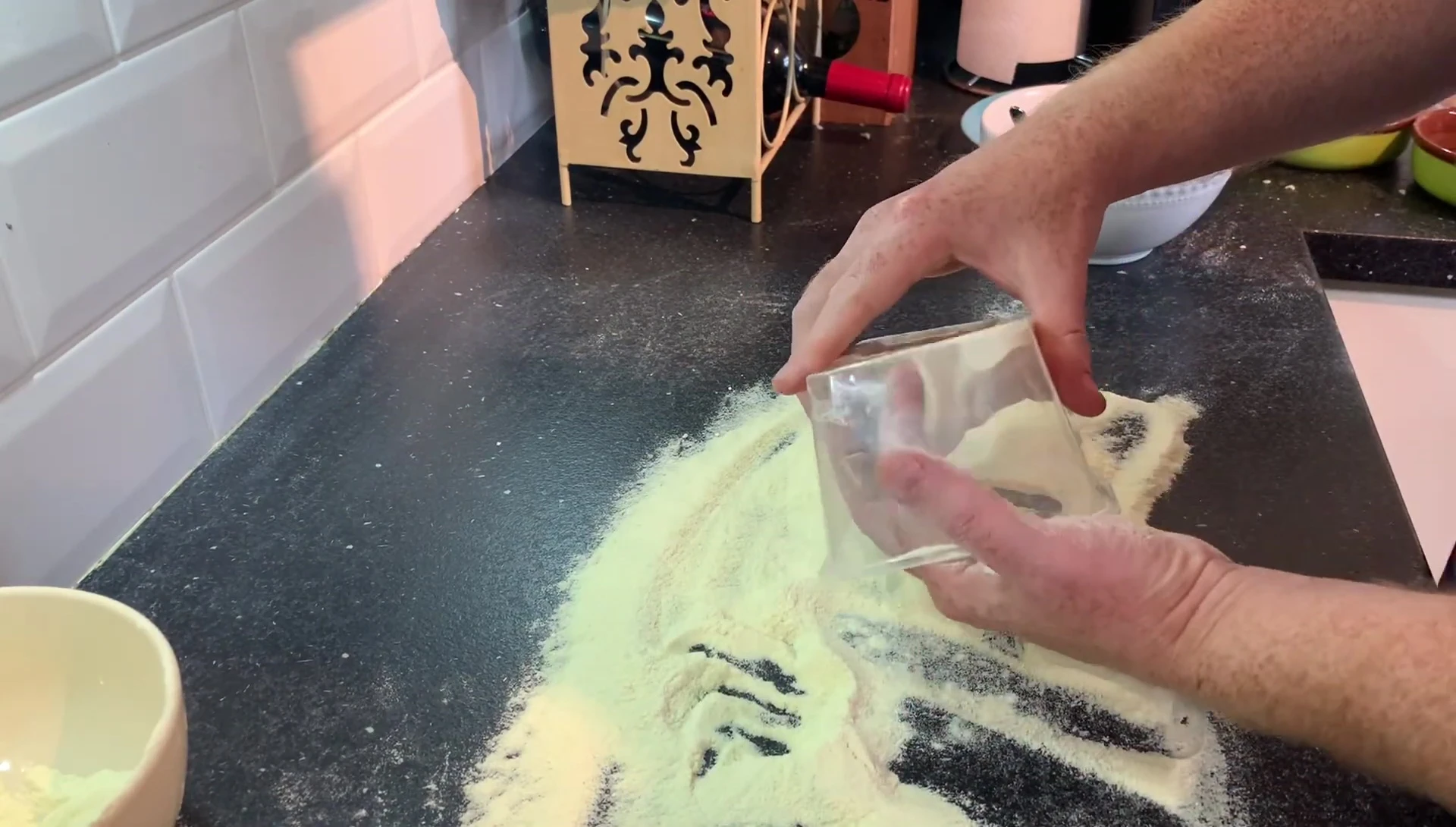 Sprinkling semolina flour on countertop