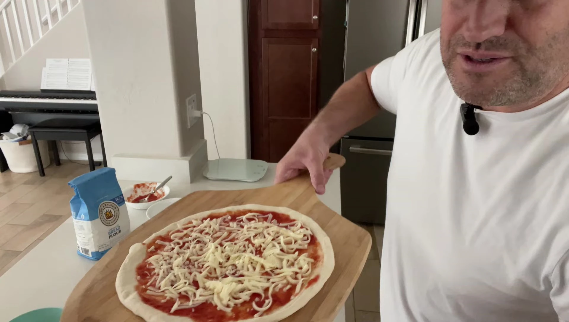 Pizza with cheese on a wooden board
