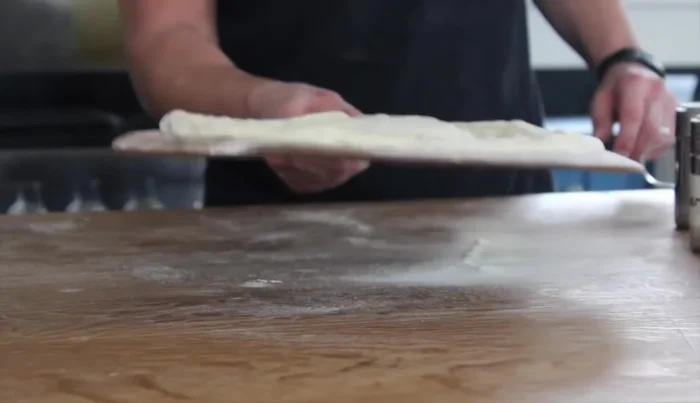 The 'Jimmy' motion: Use a gentle back-and-forth motion (the 'Jimmy') to keep the dough loose and prevent sticking.