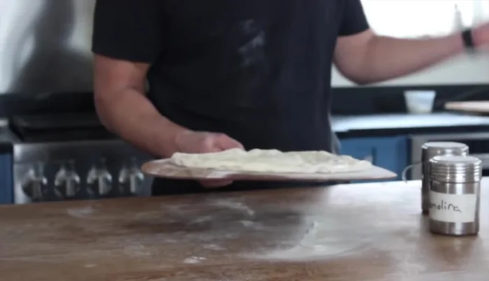 Add cheese: Add cheese in layers, again employing the 'Jimmy' motion after each layer.