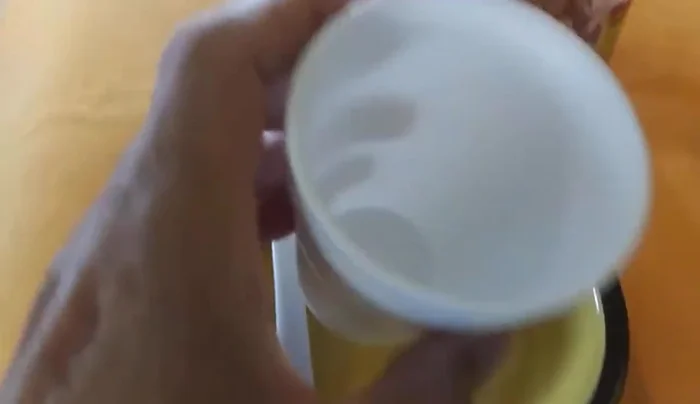 Secure the plastic wrap with a rubber band.